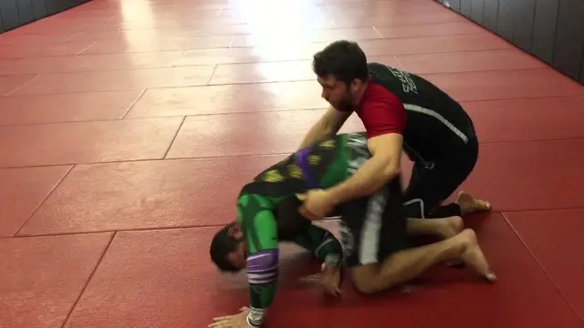 Wrestling spiral ride grip against turtle position in BJJ
