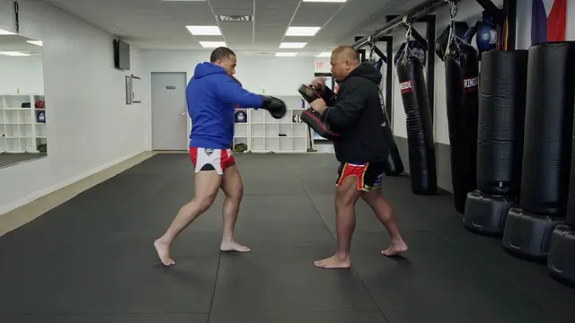 Holding Thai pads